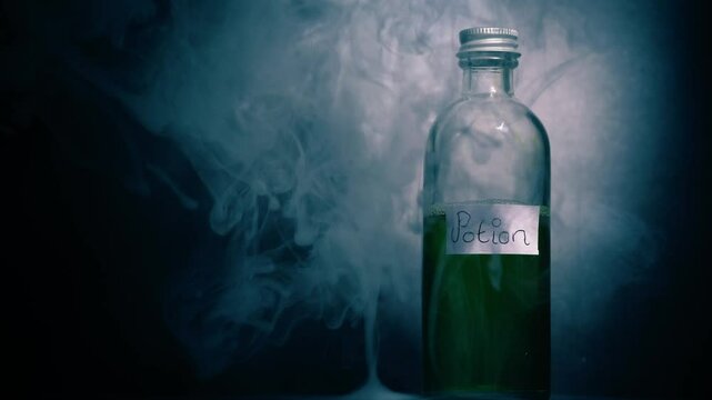 Witches potion in a bottle with smoke close up shot 