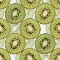 Fototapeta premium Repeating pattern of fresh kiwi fruit slices on white background for summer designs