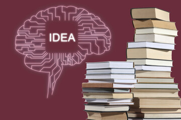 Idea and development. Brain illustration and stacks of books on burgundy background