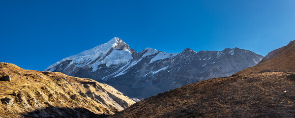 Chulu peak, view from Ledar village in autumn sunny day. Annapurna Circuit trek, Nepal.