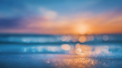 A stunning sunset casts a warm glow over the serene ocean with gentle waves lapping at the sandy beach