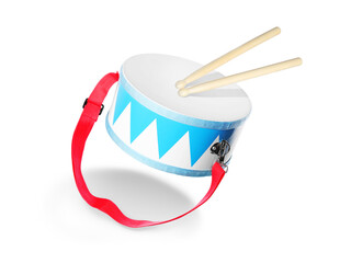Toy drum and sticks in air on white background. Child's musical instrument