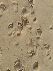 Footsteps mark on the sand at the beach