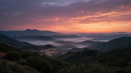 Fototapeta premium Colorful sunrise over misty hills, atmospheric layers 
