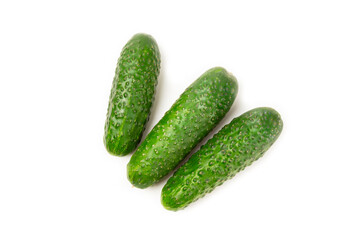 Cucumber isolated on white background. Slice of cucumber on white background. Fresh organic green cucumbers. Vegan. Ingredient for salad. Farm vegetables.