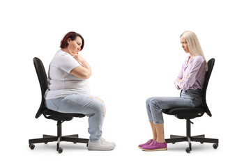 Obraz premium Angry women sitting in office chairs