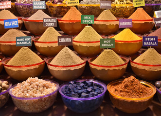 An assortment of spices with names on the shelves of a Dubai 