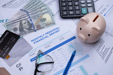 Financial documents with a piggy bank, credit cards, and a calculator illustrate budgeting and money management.