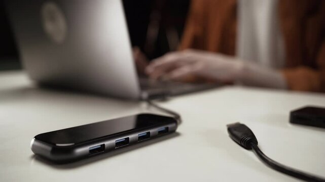 Close-up of type-c hub in laptop, turn-on cables in usb multiport