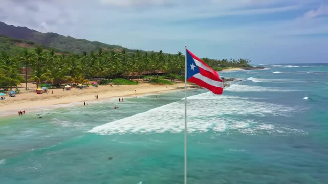 Puerto Rican silk flag waving proudly against the backdrop of a beautiful blue ocean. Enjoying a sunny day at the beach in Puerto Rico . Puerto Rican flag - the national symbol of Puerto Rico
