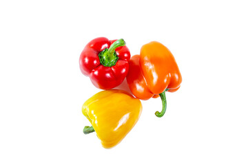 Fresh juicy shiny red, yellow and orange bell peppers. Isolated on white.