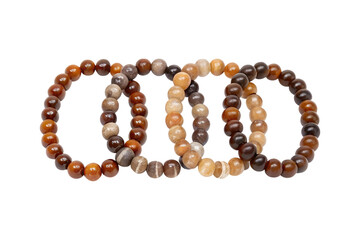 Obraz premium Four beaded bracelets arranged together with earthy tones and neutral transparent background