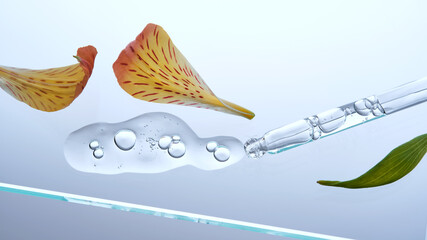 A pipette with a beautiful drop of serum on a background of lily flowers.
