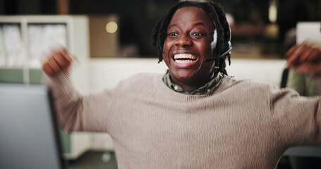 Naklejka premium Success, computer or excited black man in customer service for bonus prize, online solution or good news. Achievement, wow or happy African agent in night with smile, call center win or sales goal