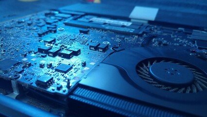 A close-up photograph of a laptop motherboard, potentially useful for illustrating concepts of computer repair, upgrades, and DIY electronics projects.