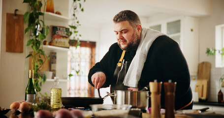 Home, man and chef in kitchen for cooking, culinary skills and ingredients on counter for dinner. House, male person and cook with experience for meal prep, gourmet cuisine and food in pan on stove