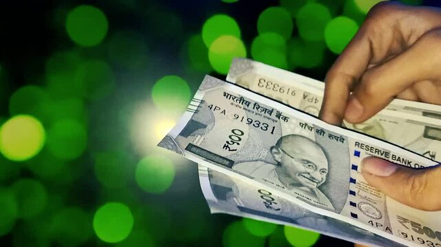 A person counts Indian 500 rupee currency bank note