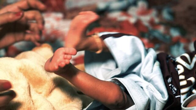 newborn baby moving our legs