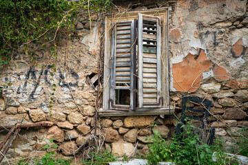 Weathered Wall and Broken Window in Anafiotika Athens