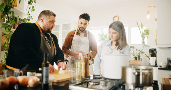Cooking class, couple and chef with teaching in kitchen for meal preparation, cutting skills and knife safety instructions. Learning course, people and food lesson with dinner process and menu advice - Powered by Adobe