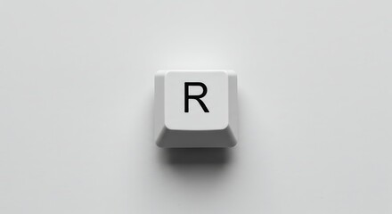 Isolated white keyboard key with the letter R on white background