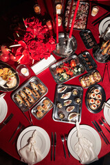 Assorted elegant canapés and hors d’oeuvres on metal trays, featuring seafood, vegetables, and savory pastries — perfect for upscale events.