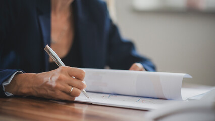 Businesswoman signing a document or contract