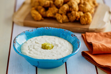 chicken nuggets with a honey mustard and tartar dipping sauce