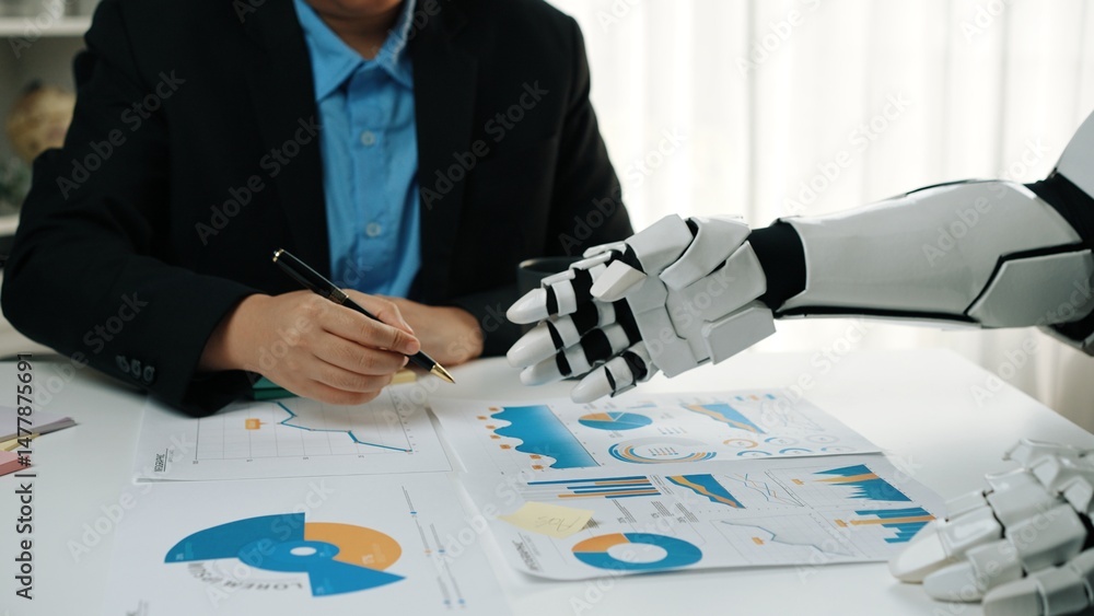 Poster a business person and a robot collaborate on data analysis, examining graphs and charts in a modern 