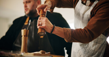 Cooking class, chef and hands of person with spices for food flavor, meal preparation or learning...