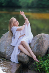 Beautiful Girl with long hair sitting in water