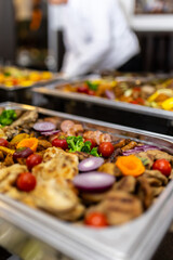Colorful array of fresh vegetables and grilled meats at a festive gathering