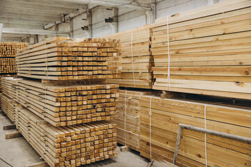 Stacked timber planks in industrial warehouse