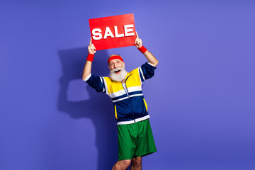 Elderly man in retro sportswear holding sale sign, promoting active lifestyle in bold vintage style against vibrant purple backdrop