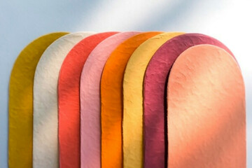 A set of five overlapping semicircular arches arranged horizontally against a white background