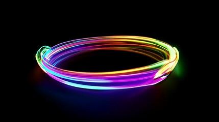 Abstract ring of multicolored light trails on black background creates modern design element for graphics