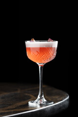 Rose Sour Cocktail
A vibrant rose-hued cocktail with silky foam, garnished with dried rosebuds. Elegant and aromatic, perfect for refined evenings or romantic settings.