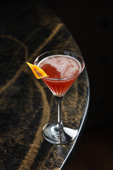 Ruby Citrus Martini
A bold ruby-red martini garnished with a citrus twist. Vibrant and tangy, this cocktail blends sweet and sour notes with elegance in a classic glass.