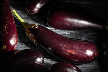 eggplant on black wood background