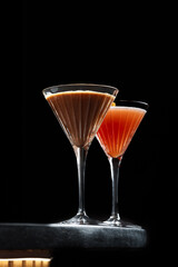 Signature Cocktails Trio – A vibrant mix of elegant, handcrafted cocktails with foam tops, floral or citrus garnishes, served in refined glassware on a moody dark background.