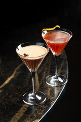 Signature Cocktails Trio – A vibrant mix of elegant, handcrafted cocktails with foam tops, floral or citrus garnishes, served in refined glassware on a moody dark background.