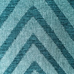 Teal chevron pattern close up abstract texture background textile design surface in studio shot for graphic element
