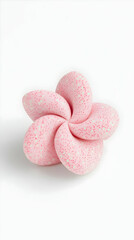 Pink sparkly flower-shaped object on white background. Craft project, decoration, or design element