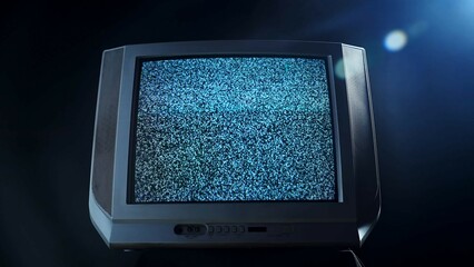 Old Television Displaying Static Noise on Screen