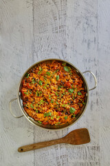 Southwest taco bake with ground beef, black beans, cheddar cheese, and fresh salsa