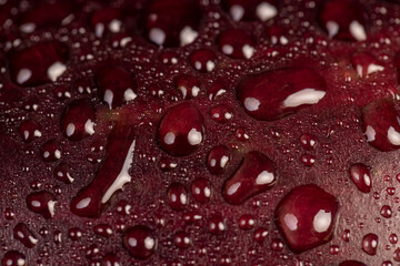 wet ripe purple eggplant covered with drops of water , ripe eggplant on the table before cooking