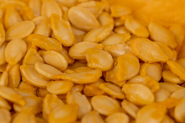 preparing orange pumpkin for cooking, pumpkin seeds inside