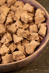 cork wood on the table, small pieces of cork bark for domestic use, close up pieces in a wooden bowl