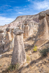 Fairy chimneys, unique rock formations near Cavusin Town in Cappadocia, Turkey..
