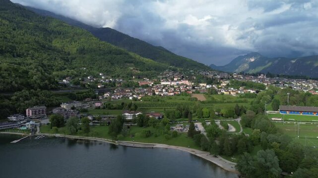 Levico Lake Italy Aerial View &ndash; 4K Drone Footage of Alpine Town, Mountain Landscape, Green Hills and Waterfront in Trentino, Summer Travel Destination in Northern Italy